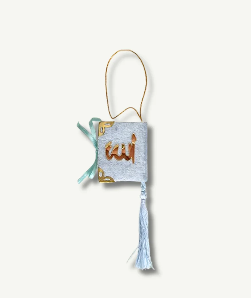 Mini Coran bleu - le Livre Saint de l'Islam disponible à la Boutique Paradis Oriental, contenant les révélations d'Allah au Prophète Muhammad, des versets et des sourates.